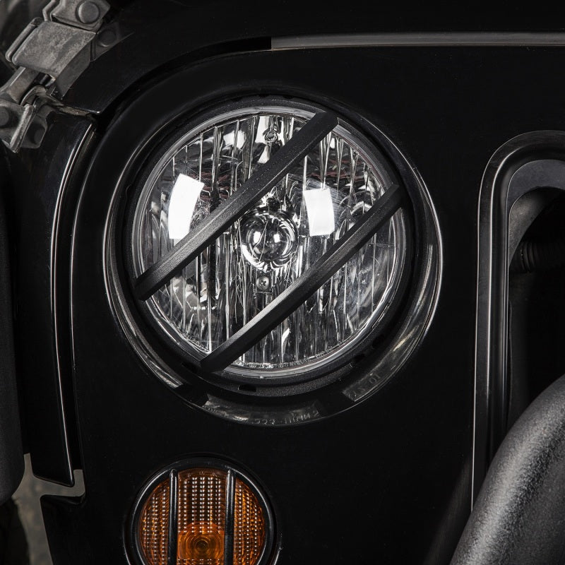 Rugged Ridge Black Elite Pivotal Headlight Euro Guard: Fits Most Jeep Wrangler Models (2007-2018)
