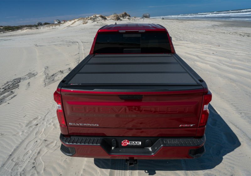 BAK 19-21 GMC Sierra 1500 (Carbon Pro Bed) 5ft 8in Bed BAKFlip MX4 Matte Finish | GMC Sierra 1500 (19-26), Sierra AT4 (22-26), Sierra AT4X (22-26) Tonneau Covers offroad accessory | Iron Ridge Offroad