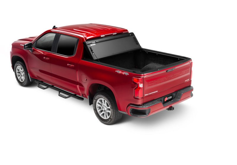 BAK 19-21 GMC Sierra 1500 (Carbon Pro Bed) 5ft 8in Bed BAKFlip MX4 Matte Finish | GMC Sierra 1500 (19-26), Sierra AT4 (22-26), Sierra AT4X (22-26) Tonneau Covers offroad accessory | Iron Ridge Offroad