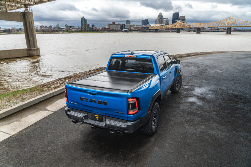 UnderCover Ultra Flex Folding Truck Bed Cover (5.7ft) w/ Multifunction Tailgate: Ram 1500 (19-26)
