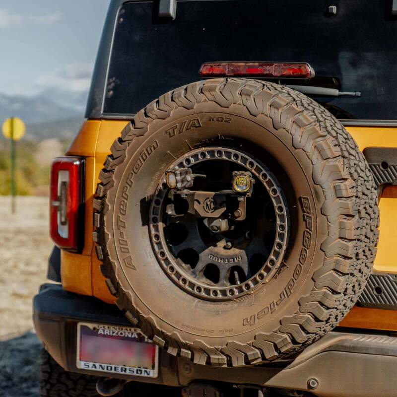 KC HiLiTES 2021+ Ford Bronco Raptor Spare Tire Carrier Light Mount w/ M14x1.5 Lug Nuts Lights offroad accessory | Iron Ridge Offroad